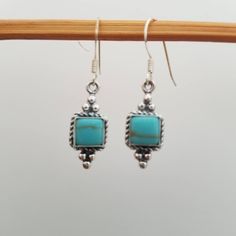 Turquoise Dangle Earrings/925 Sterling Silver Drop Earrings/French Hook Earrings. Kingman turquoise, sterling silver Square dangle with french hook earrings. These are a pair of earrings that will go with any outfit. They feature a beautiful Southwestern look. *Length: 1 1/4 inches with ear wire  * Width: 8mm  Please note: Each of the stone will have slight variations.  No two stones are the same because of its nature. You will receive the earrings in a gift box.   * Handmade in USA  Thanks for looking and check out more collections in our Etsy shop for more great items and deals!! https://www.etsy.com/shop/lovelyturquoise Turquoise Nickel-free Southwestern Earrings, Nickel-free Turquoise Southwestern Earrings, Gift Box Handmade, Turquoise Dangle Earrings, French Hook Earrings, Turquoise Earrings Dangle, Sterling Silver Drop Earrings, Box Handmade, Kingman Turquoise