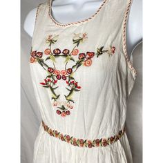 Adorable Embroidered Boho White Dress With Tassel-Tie At Back Of Neck. Hidden Elastic In Waist For Perfect Fit. Sleeveless Cotton Dress With Embroidered Hem, Sleeveless Cotton Embroidered Dress With Embroidered Hem, Sleeveless Cotton Dress With Embroidered Neckline, Spring Sleeveless Embroidered Dress, Sleeveless Embroidered Dress For Spring, Spring Sleeveless Dress With Intricate Embroidery, Beige Embroidered Hem Dress For Summer, Beige Embroidered Dress With Hem Detail For Summer, Casual Beige Cotton Embroidered Dress