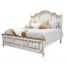 an old white bed with pillows and blankets on it's headboard, against a white background