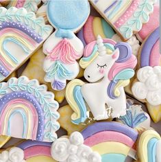 some cookies that are shaped like unicorns and rainbows