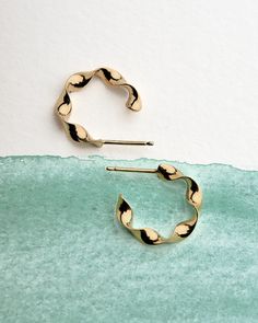 "Take your love for cute hoop earrings and add a twist of fun to it with these Twisted Design Small Hoop Earrings. Featuring a great design that is also unique, these cute hoop earrings are the best dainty small hoops to add an eclectic look to your ear jewelry collection! These dainty small hoops are also the perfect jewelry gift for her that she will appreciate for many wearings to come! Give these hoop piercings to the guy or gal in your life who wears hoop earrings that are a unique twist on Cute Hoop Earrings, Twisted Earrings, Earrings Small Hoop, Twist Hoop Earrings, Small Gold Hoop Earrings, Small Gold Hoops, Small Hoop Earrings, Huggie Hoop Earrings, Ear Jewelry