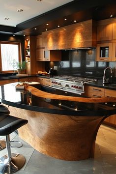 a modern kitchen with an island counter and stools in the center, surrounded by wooden cabinets