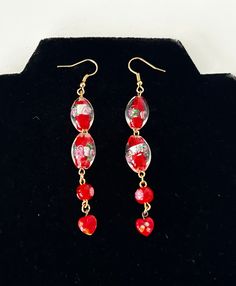 Vintage Venetian & Millefiori Red Glass Beaded Earrings  In great condition  Earrings measure 9cm Red Drop Beaded Earrings For Celebration, Handmade Red Flower Earrings For Festive Occasions, Red Drop Flower Earrings For Festive Occasions, Festive Red Flower Drop Earrings, Red Beaded Dangle Flower Earrings, Red Dangle Flower Earrings With Colorful Beads, Red Flower Dangle Earrings With Colorful Beads, Handmade Red Glass Earrings, Red Flower Earrings With Colorful Beads As Gift