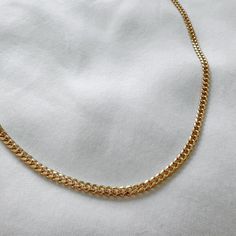 90's Vintage style textured cuban chain. The perfect length to wear alone or layer with other necklaces. 14k Gold Filled Chain Width: 3.6mm / Thickness: 1.7mm Chain length: 17.75” Lobster clasp closure Hypoallergenic Water resistant & tarnish free Nickel & lead free Curb Chain Link Necklace, Minimalist Cuban Link Chain Necklace With Curb Chain, Minimalist Chunky Cuban Link Chain Necklace, Minimalist Cuban Link Chunky Chain Necklace, Everyday Cuban Link Necklace With Adjustable Chain, Minimalist Cuban Link Curb Chain Necklace, Yellow Gold Curb Chain Choker Necklace, Yellow Gold Curb Chain Choker, Everyday Curb Chain Link Necklace