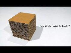 a stack of cardboard with the words box with invisible lock?