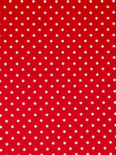 a red background with white polka dots