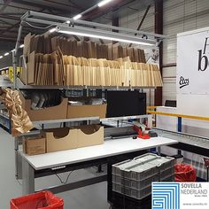 boxes are stacked on top of each other in an assembly line at the company's factory