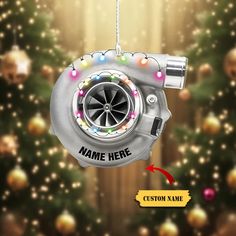 a car engine ornament hanging from a christmas tree