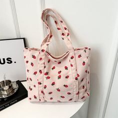 Stay organized and stylish with our Strawberries Corduroy Large Capacity Handbag. With its spacious interior and adorable strawberry print, it's perfect for carrying all your essentials. Say goodbye to clutter and hello to convenience with this must-have accessory. Strawberry Tote Bag, Handbags For School, Beg Tangan, Girls Handbags, Strawberry Print, Hair Accessories Jewelry, Shoulder Tote Bag, Large Tote Bag, Handbags For Men