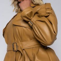 The Plus Azalea Wang Keeping It Short And Classy Pleather Crop Trench Is Made From A Vegan Leather Fabrication, And Is Complete With A Cropped Length, Front Flap Detail, Epaulette Shoulder Detail, A Collared Neckline, Two Side Pockets, Buckle Wrist Details, Waist Belt, And A Front Zipper Closure. - 94% Polyester 6% Spandex - Hand Wash Cold Yellow Leather Jacket For Spring With Long Sleeves, Chic Mustard Outerwear For Fall, Yellow Long Sleeve Leather Jacket For Fall, Yellow Leather Jacket For Fall, Yellow Long Sleeve Leather Jacket For Spring, Chic Mustard Outerwear For Work, Yellow Leather Jacket With Long Sleeves, Yellow Leather Winter Outerwear, Spring Faux Leather Single-breasted Outerwear