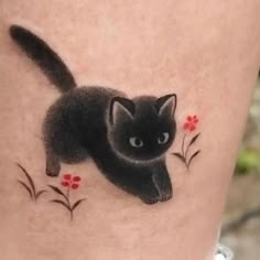 a black cat with red flowers on it's side tattoo design by the artist