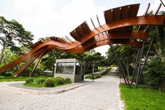 a wooden sculpture in the middle of a park