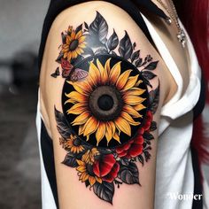 a woman's arm with a sunflower and leaves tattoo on the left shoulder