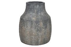 a large gray vase sitting on top of a white background