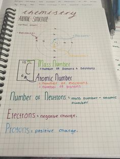 an open notebook with writing on it and various numbers written in different colors next to each other