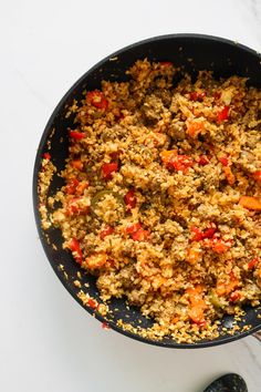 a skillet filled with food on top of a white counter