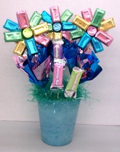 a vase filled with assorted candy bars