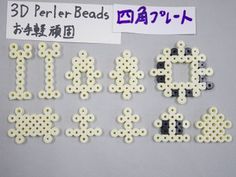 some type of bead letters and numbers on a white surface with purple writing that says 3d perler beads