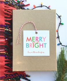 a brown paper bag with a merry and bright tag on it