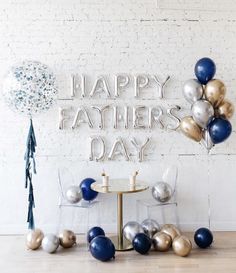 a happy father's day party with balloons and decorations