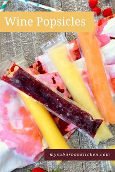 wine popsicles with strawberries and raspberries in the background