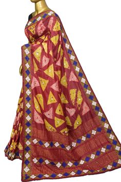 Look classier than ever with our fresh collection of pure tussar silk saree with elegant work on kantha stitch embroidery, Gujrati stitch, and mirror work on the whole body, pallu, and border to make it more enticing with the use of multi-colored hand shibori dye work. Color: A shade of maroon and multiple colors Technique: A pure and refined hand-done Kantha stitch, Gujarati Mirror, and stitch work along with multi-colored hand shibori dye work Fabric: Tussar Quality: IndyVogue's Assurance of S Luxury Saree With Multicolor Embroidery And Zari Weaving, Transitional Embroidered Slub Silk Pre-draped Saree, Diwali Slub Silk Traditional Wear With Resham Embroidery, Bollywood Style Slub Silk Traditional Wear, Red Traditional Wear In Slub Silk With Cutdana, Navratri Slub Silk Traditional Wear With Dupatta, Bollywood Style Cotton Silk Saree With Dori Work, Diwali Designer Slub Silk Traditional Wear, Pre-draped Cotton Silk Saree With Dori Work For Festivals