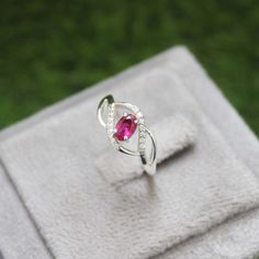 * Material: 925 Sterling Silver * DETAILS ✥ Handmade Ring ✥ - Center Stone: Lab Ruby - Center Stone Size: 4X6 MM - Center Stone Shape: Oval  - Side Stone: CZ diamond  - Band Color: Silver Shiny ✥ O T H E R ∙ I N F O R M A T I ON ✥ ♦ Your item will be nicely packed to gift in elegant jewelry boxes. ♦ Custom Order We can make custom rings in almost any shape and style. If you want a specific model, please send us a clear picture and we will do our best. ♦ Delivery All Item will be Shipped within 3 Oval Ruby Ring For Promise, Oval White Gold Ruby Promise Ring, Oval Ruby Crystal Promise Ring, White Gold Oval Ruby Birthstone Ring, Oval Ruby Birthstone Ring In White Gold, Oval Ruby Rings With Birthstone, Red Oval Birthstone Diamond Ring, Oval Ruby Birthstone Crystal Ring, Red Oval Diamond Birthstone Ring