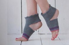 a woman's feet wearing crocheted sandals