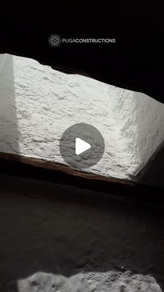 an image of the inside of a building that is covered in snow and has a play button