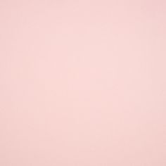 a pink background with white dots on it