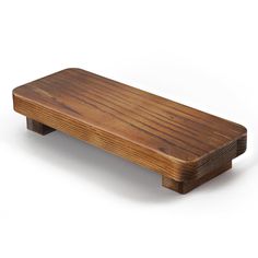 a wooden bench sitting on top of a white floor