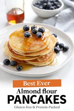 the best ever almond flour pancakes with blueberries and maple syrup are ready to be eaten