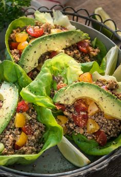 lettuce, tomato and avocado salad with ground meat dressing on top