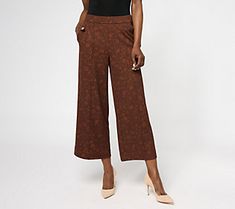 These printed knit culottes are a fashion-forward choice with an allover print and a front pintuck detail. From Isaac Mizrahi Live!TM. Elegant Printed Pants For Workwear, Printed Brown Bottoms For Spring, Casual Patterned Bottoms For Fall, Chic Printed Fall Pants, Casual Patterned Fall Bottoms, Chic Printed Pants For Fall, Casual Fall Patterned Bottoms, Chic Patterned Bottoms With Floral Print, Chic Floral Print Patterned Bottoms