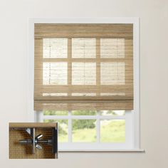 a window with blinds that are made out of bamboo and some other things on the windowsill