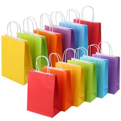 colorful shopping bags are lined up against a white background, each with different colored handles