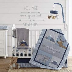 a baby crib bedding set with an animal theme