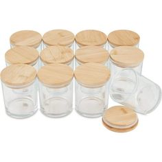 six clear jars with wooden lids