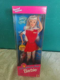 the barbie doll is in its original box