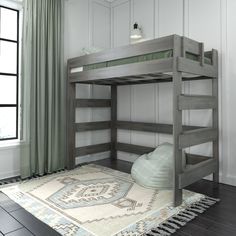 a bunk bed with a rug on the floor