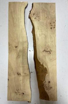 two pieces of wood that have been cut in half