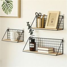 two metal shelves with books and other items on them