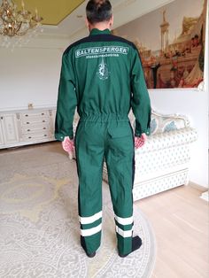 "One Piece green Coveralls vintage green Jumpsuit mens Overalls zip up mens Coveralls utility workwear mechanic uniform L 100 % cotton height of the men in the photo - 190 cm Please refer to photos for details of condition. Condition: very good vintage Measurements : Length: 157 cm/ 61.8\" Sleeve from the neck: 78cm/30.7 \" Bust: 132 cm/52.0\" Waist: 70-100 cm/27.6-39.4\" Hips: 118 cm/46.5 \" Rise: 77 cm/30.3 \" Inseam: 75 cm/29.5\" Size: l note The color on the pictures may vary due to monitor Mechanic Uniform, Mechanics Uniform, Mens Coveralls, Clown Pants, Leather Blazer Women, Leather Coat Womens, Mens Overalls, Black Leather Coat, Rainbow Outfit