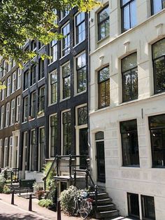 an apartment building with many windows and stairs