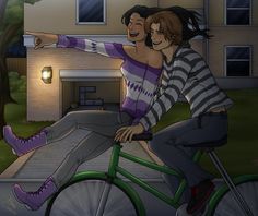 two people are riding on a bicycle in front of a house and one person is pointing at something