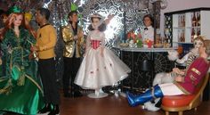 several dolls are dressed up in costumes for a party