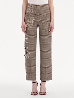 Crafted from virgin wool and finished with a Prince of Wales plaid print, these pants are defined by perfectly placed peony guipure appliqués. With a straight leg cut and high waist, these pants are both a statement and a staple. High Waisted Banded Waist Straight Leg Silhouette Concealed Side Zipper Unlined 100% Virgin Wool Embroidery; 100% Polyester FINAL SALE Chic Embroidered Trousers, Elegant Embroidered Straight Pants, Floral Embroidered Straight Pants For Workwear, Floral Embroidery Straight Pants For Workwear, Floral Embroidery Straight Pants For Work, Embroidered Trousers For Work, Embroidered Straight Pants For Workwear, Elegant Floral Embroidery Trousers, Embroidered Wide Leg Workwear Bottoms