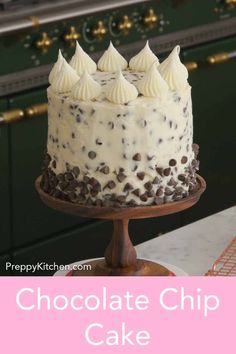 a chocolate chip cake with white frosting on top