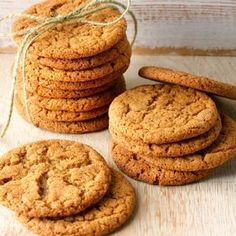 cookies are stacked on top of each other with a string tied to the top one