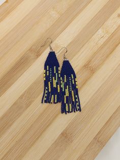 Unique dark blue, lime green and yellow long fringe dangle earrings are super fun with tons of character.  On the longer side measuring 3.5 inches but not too long for every day wear.  Handcrafted using quality glass Japanese seed beads for colour to last. 3.5 inches in length dark blue, lime green and yellow in colour light weight Blue Fringe Earrings As Gift, Blue Fringe Earrings For Gift, Blue Fringe Drop Earrings, Blue Fringe Tassel Drop Earrings, Long Fringes, Beaded Fringe, Green Earrings, Fringe Earrings, How To Make Earrings